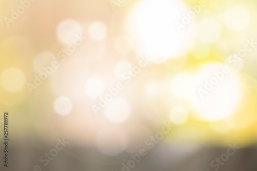 Gold bokeh texture. Festive glitter background with defocused lights © Saichol