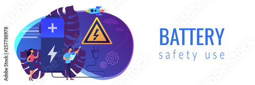 Engineers make recharging battery safe with plug and high voltage warning sign. Safety battery, protected energy device, battery safety use concept. Header or footer banner template with copy space.