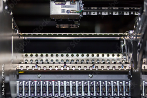 close up automatic component feed unit of PCB LED SMT pick and place machine feeder for assembly electronic board