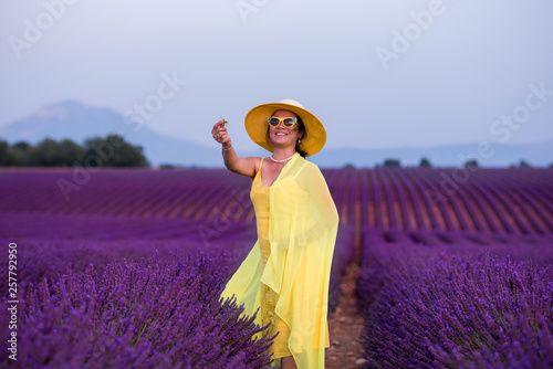 asian woman in yellow dress and hat at lavender field