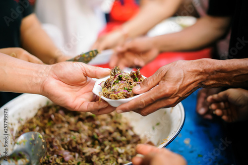 Bilde på lerret Charity concept : Feeding the poor to help each other in society.