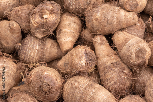 Heap of raw dasheen roots close-up in a chinese market, Chengdu, China