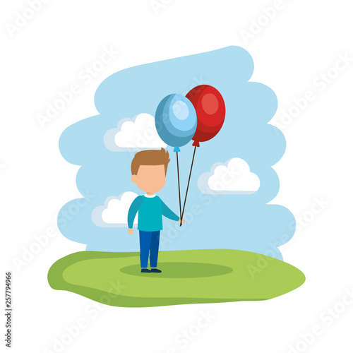 cute little boy with balloons helium in the park