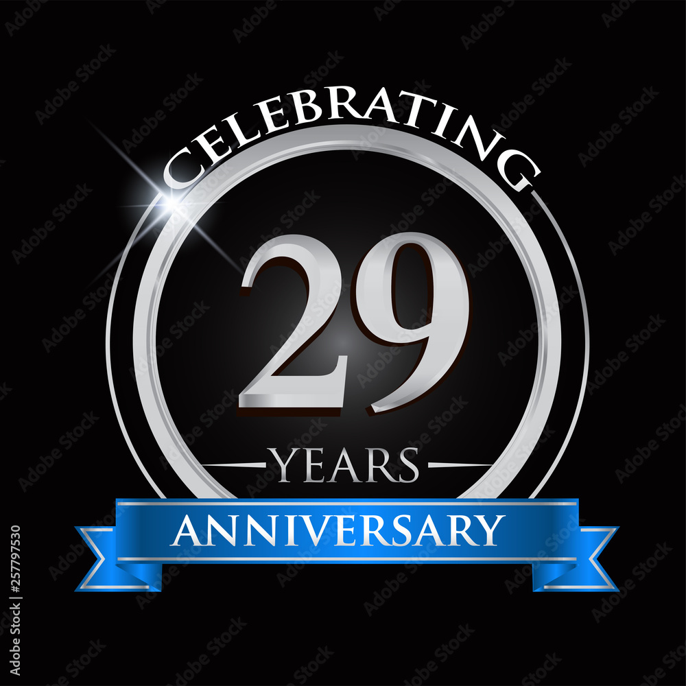 Celebrating 29 years anniversary logo. with silver ring and blue ribbon. Celebrating 29 years anniversary logo. with silver ring and blue ribbon.
