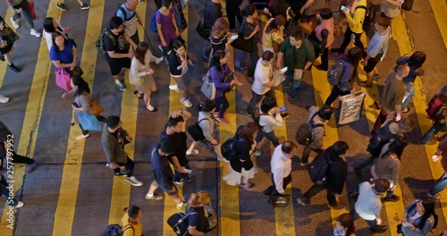 Top view of people cross the road in Hong Kong at night