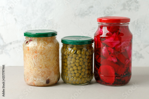 Marinated pickles variety preserving jars. Homemade green beans, sauerkraut with cranberries, pickled cabbage with beetroot. Fermented food, copy space