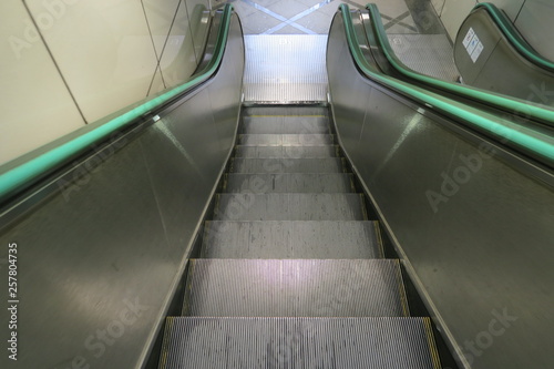 An escalator going to the basement