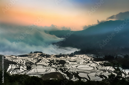 Aerial view of Yuanyang rice terraces with its mystic sea of clouds at daybreak photo