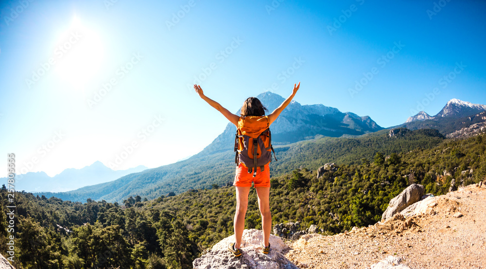 Obraz premium Girl at the top of the mountain.