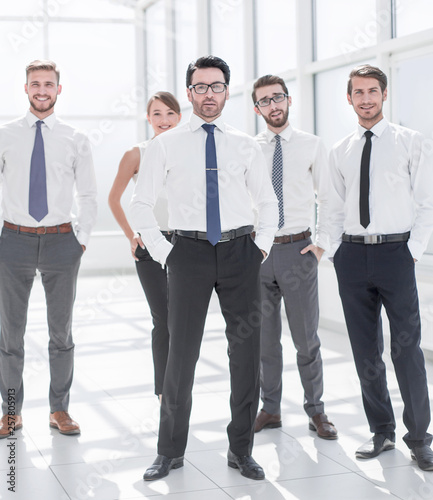 group of young employees standing in the office