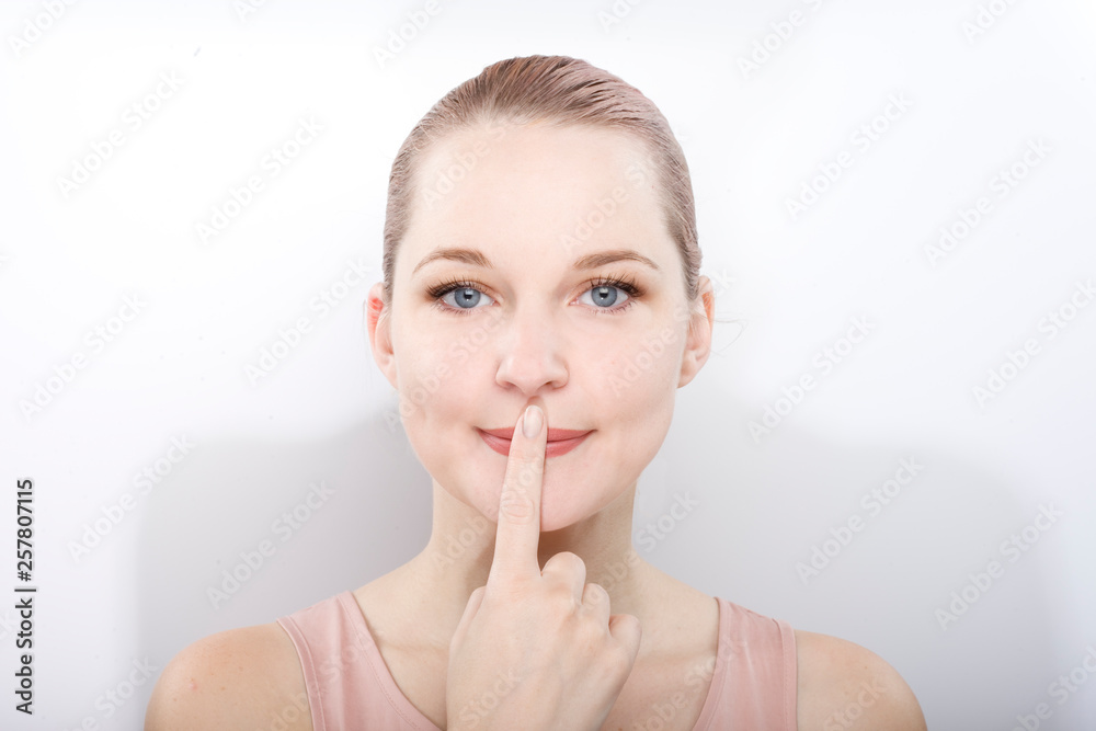 facial gymnastics. the girl does massage and rejuvenating exercises for the face facial gymnastics. the girl does massage and rejuvenating exercises for the face