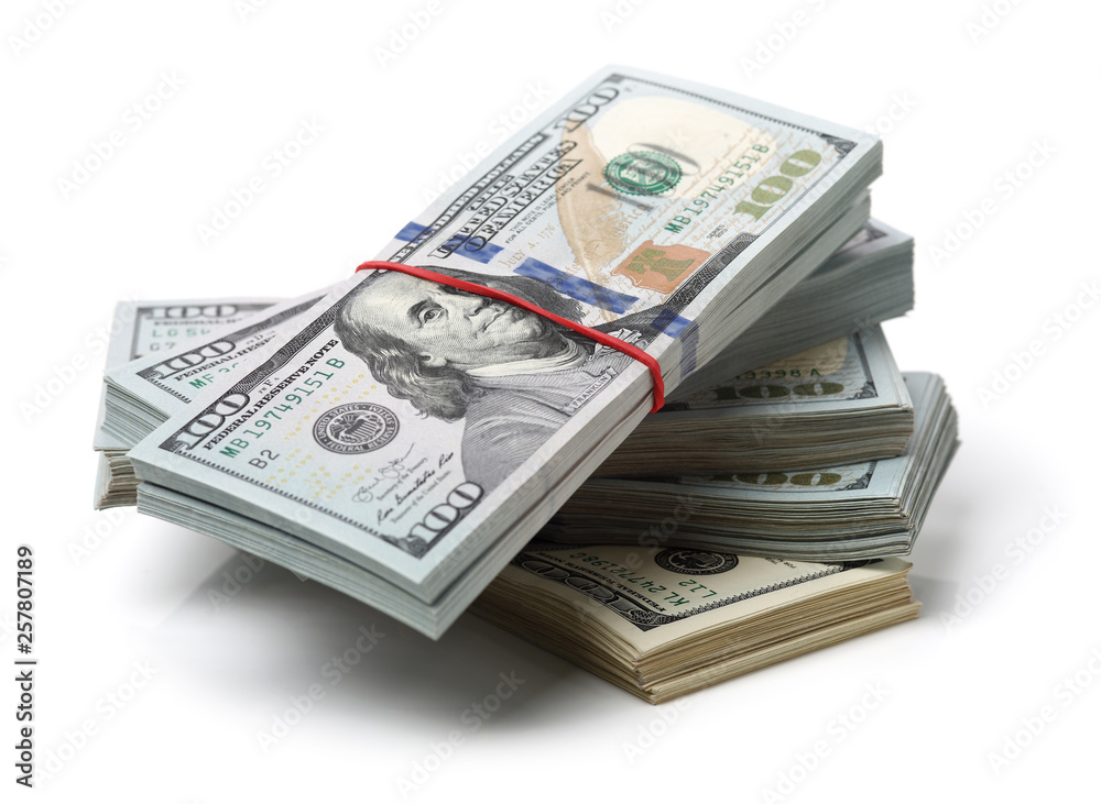 Many bundle of US 100 dollars bank notes isolated on white background Many bundle of US 100 dollars bank notes isolated on white background