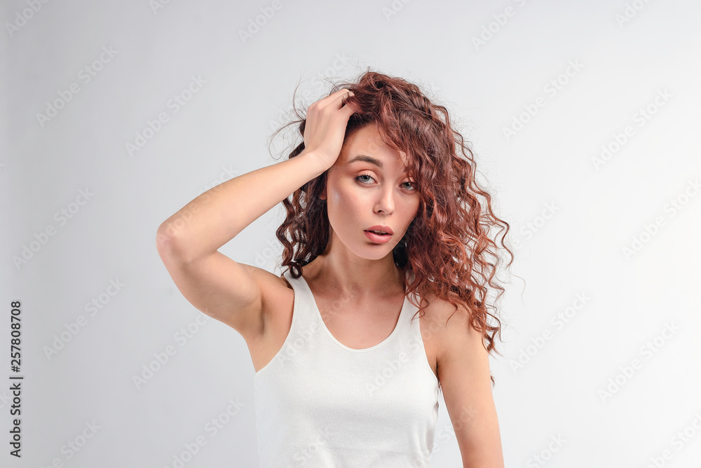 Brunette woman having headache and hangover isolated over white background Brunette woman having headache and hangover isolated over white background