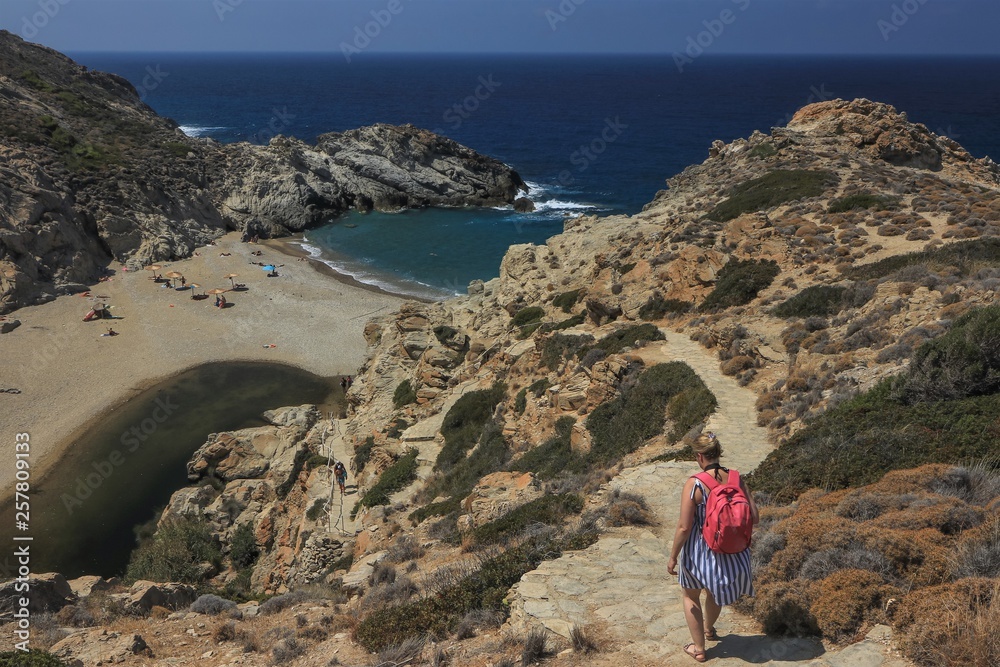 holiday maker on the path to Nas beach on Ikaria island