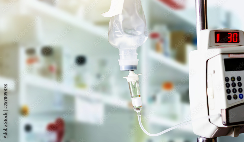Closeup of saline with syringe controlled by electronic systems Closeup of saline with syringe controlled by electronic systems