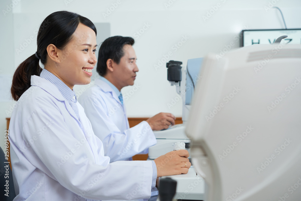 Fototapeta premium Optometrists working at office