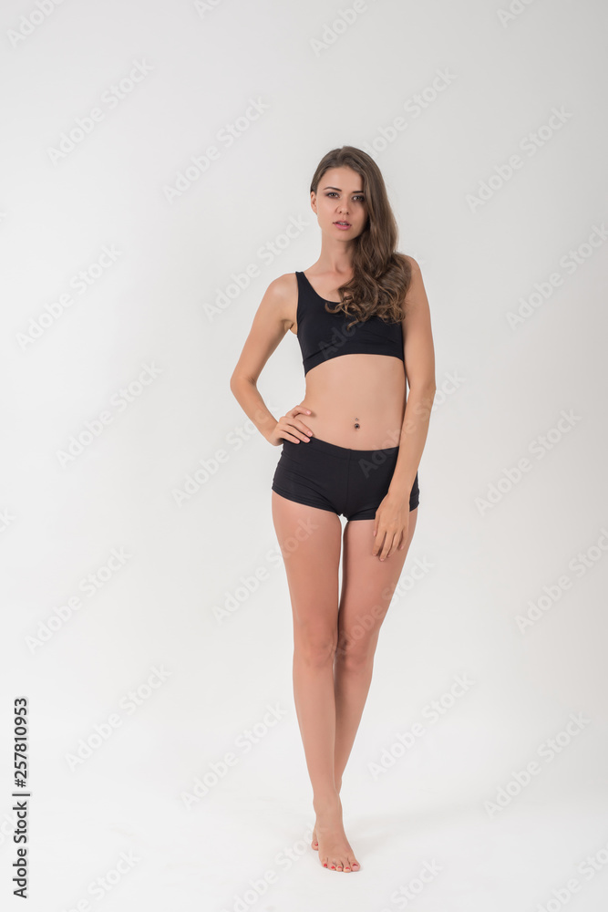 Beautiful woman with healthy body on white background