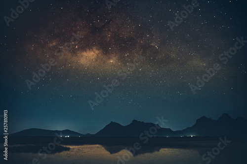 Milky way galaxy with stars and space dust in the universe,It's beautiful.Is a rotating orbit in landscape thailand
