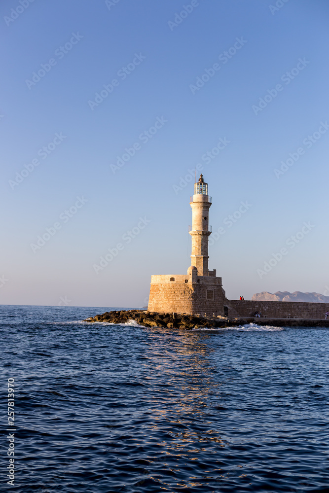 Lighthouse in the Old Venetian Harbour in the golden hour Chania Crete