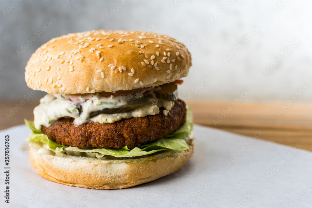 veggie burger on wooden table gray background