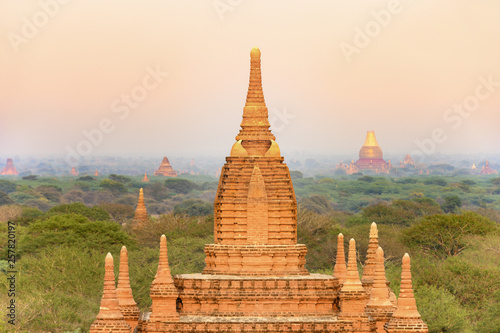 Close-up view of one of the many Buddhist temples in Bagan (formerly Pagan) during sunset. The Bagan Archaeological Zone is a main attraction in Myanmar with over 2,200 temples and pagodas.