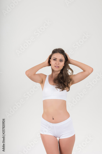 Beautiful woman with healthy body on white background
