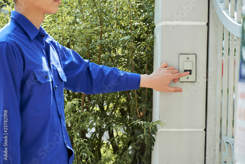 Photography Man ringing in doorbell