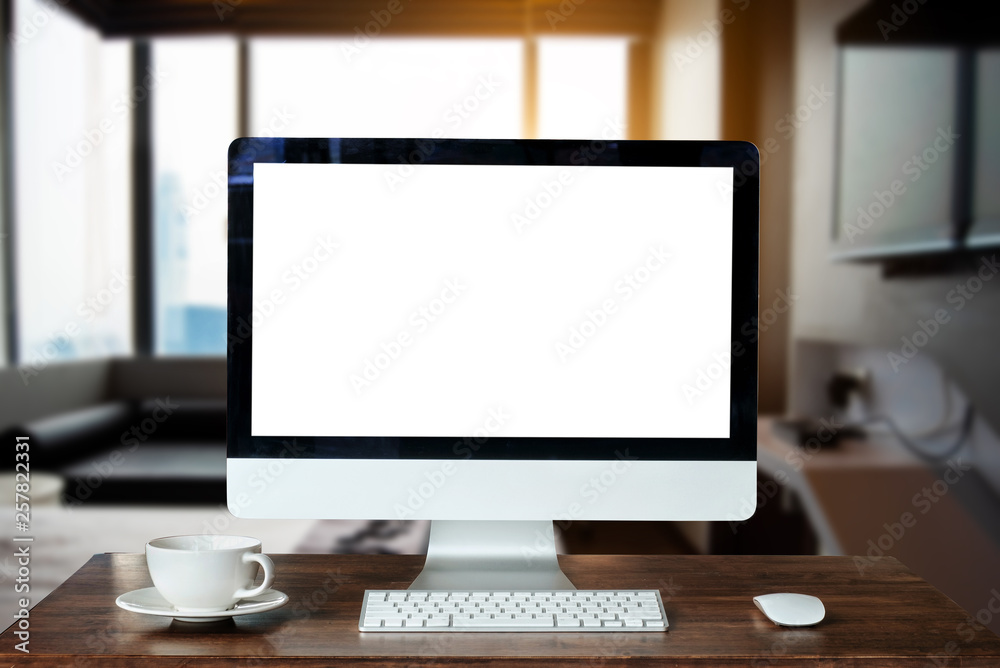 workspace with computer, laptop, office supplies, and coffee cup, smartphone, and tablet at office. desk work concept. in morning light
