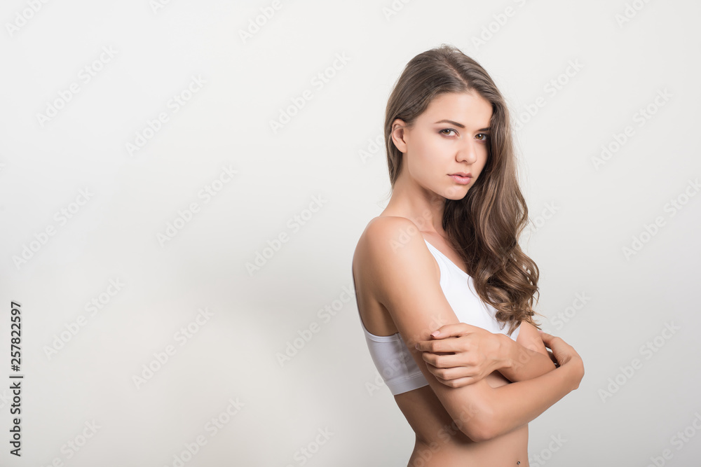 Fototapeta premium Beautiful woman with healthy body on white background