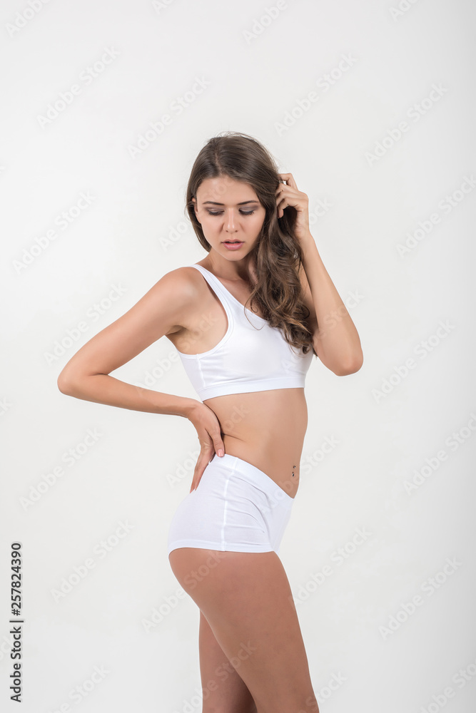 Fototapeta premium Beautiful woman with healthy body on white background