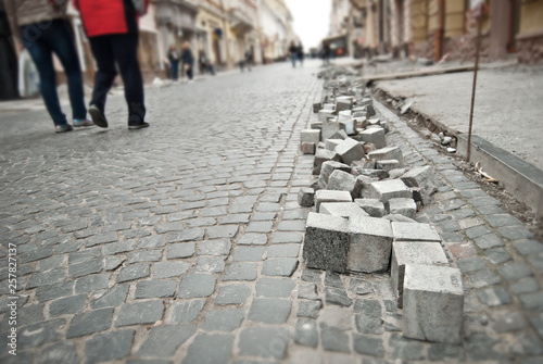 Paving the street in the city. Replacement of old paving tiles. Repairs. Chernivtsi, Ukraine, Europe, March 2019. © Ivan
