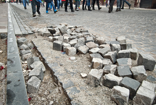 Paving the street in the city. Replacement of old paving tiles. Repairs. Chernivtsi, Ukraine, Europe, March 2019.