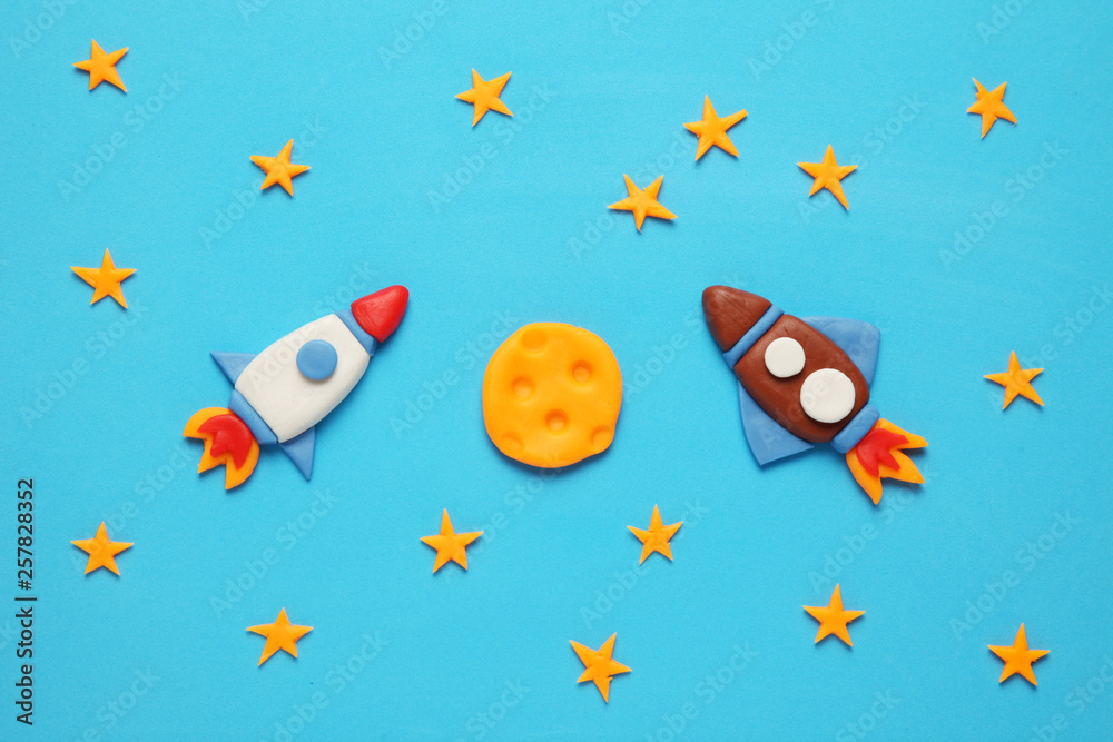 Two kid (child) rocket in space, adventure and science. Stars, and moon. Plasticine art, cartoon.