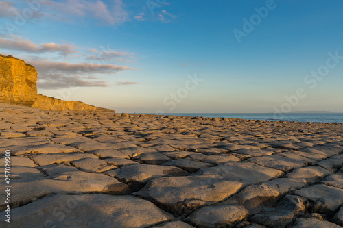 The stones and cliffs of Llantwit Major Beach in the evening sun  South Glamorgan  Wales  UK