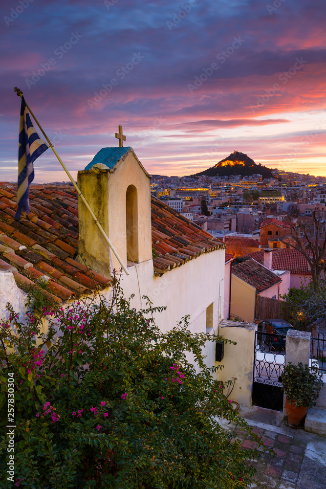 View of Lycabettus hill from Anafiotika neighborhood in the old town of Athens, Greece. 
