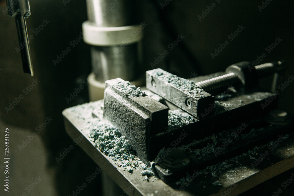Machine parts in operation, with chips. Shop with machines for wood processing. Machine parts in operation, with chips. Shop with machines for wood processing.