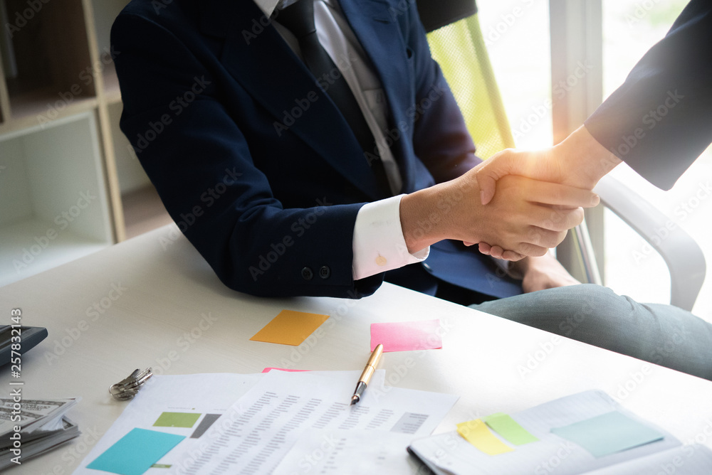 Close up of Business people shaking hands, finishing up meeting, business etiquette, congratulation, merger and acquisition concept Close up of Business people shaking hands, finishing up meeting, business etiquette, congratulation, merger and acquisition concept