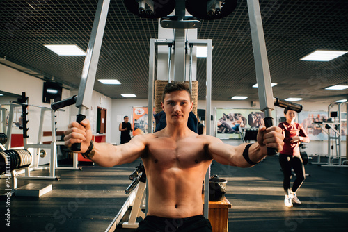 msucle guy training in a gym photo