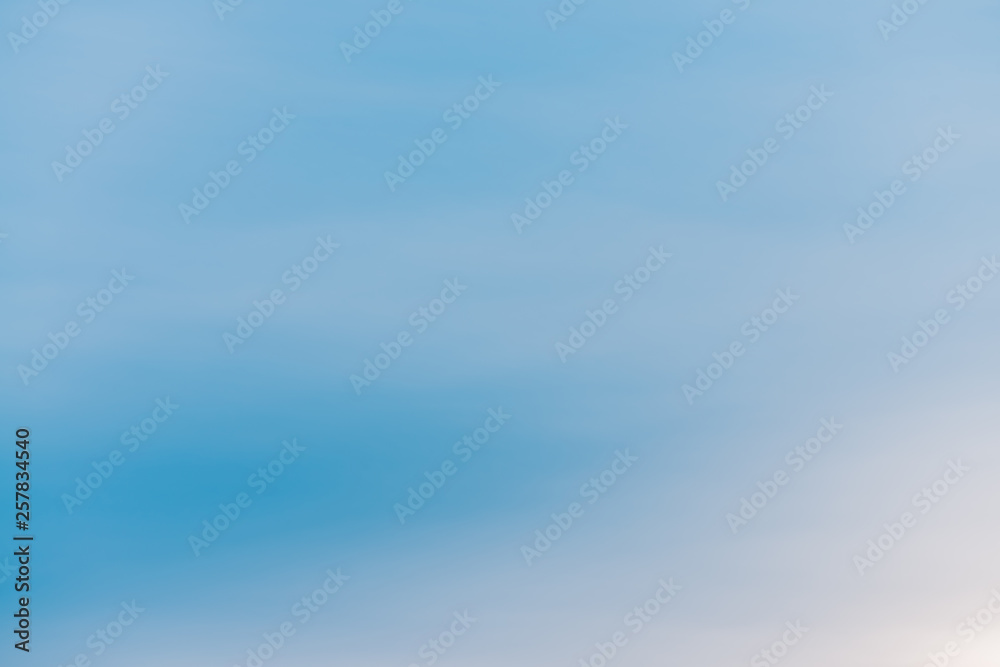 Blue day clear sky with light clouds. Smooth blue white gradient of sky. Wonderful weather. Background of morning. Heaven at morning with copy space. Slightly cloudy backdrop. Atmosphere of clear day.