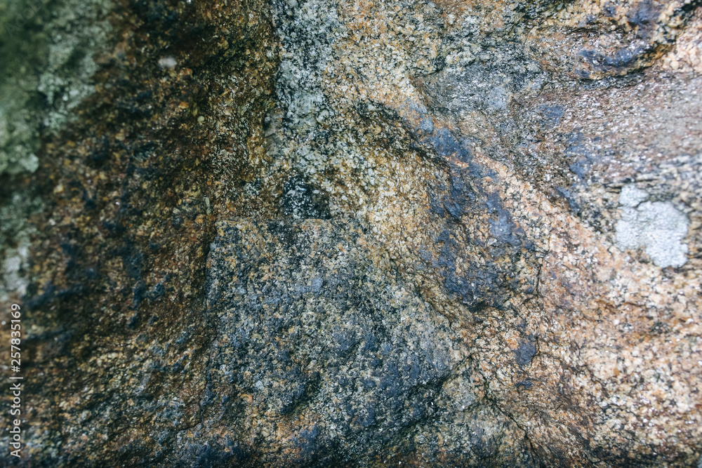 Old natural grey stone texture with moss background. Old natural grey stone texture with moss background.