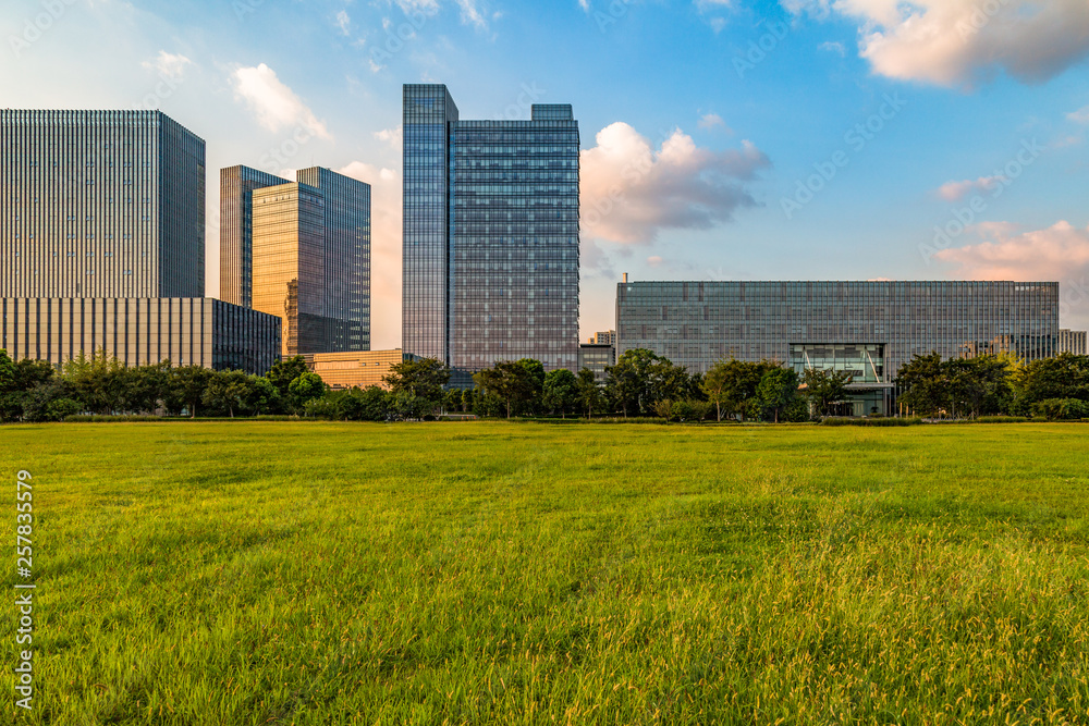 beautiful green meadow near modern office building. beautiful green meadow near modern office building.