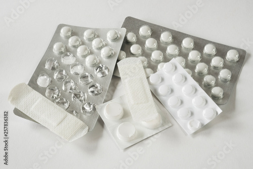 close up assorted pharmaceutical medicine pills, tablets against white background