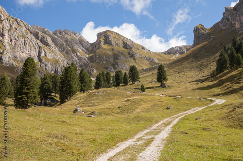 wide autumnal view over a pasture in the val di Funes area Dolomites