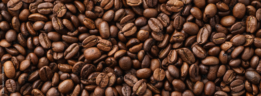 Roasted coffee beans background. Top view. Space for text. Roasted coffee beans background. Top view. Space for text.