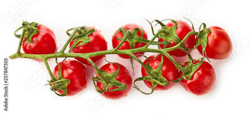 Cherry tomatoes with green leaves top view isolated on white background