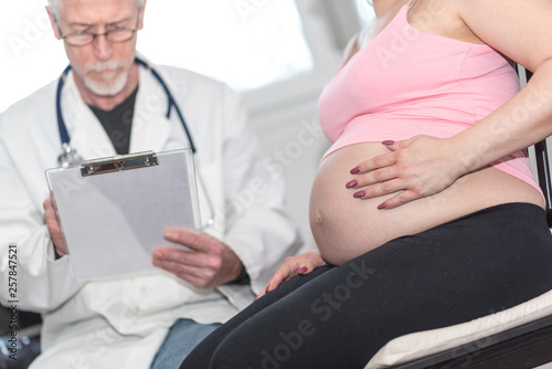 Pregnant woman and doctor