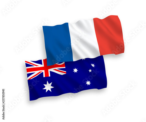 National vector fabric wave flags of France and Australia isolated on white background. 1 to 2 proportion.