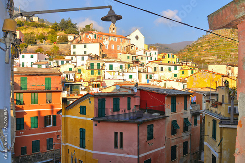 View of the colorful houses along the streets on a sunny day in Vernazza, Italy . Vernazza is one of the five famous Cinque Terre villages