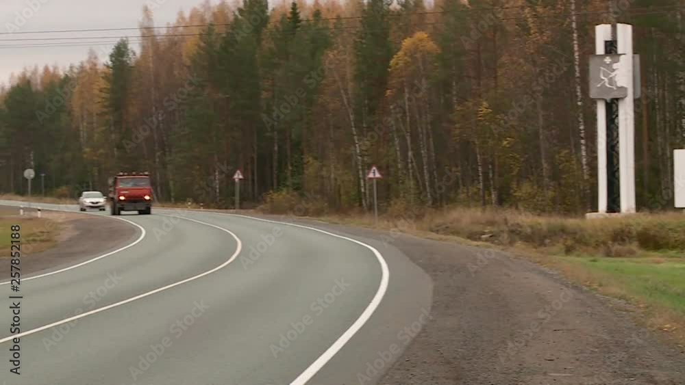 cars go on the highway in the autumn cars go on the highway in the autumn