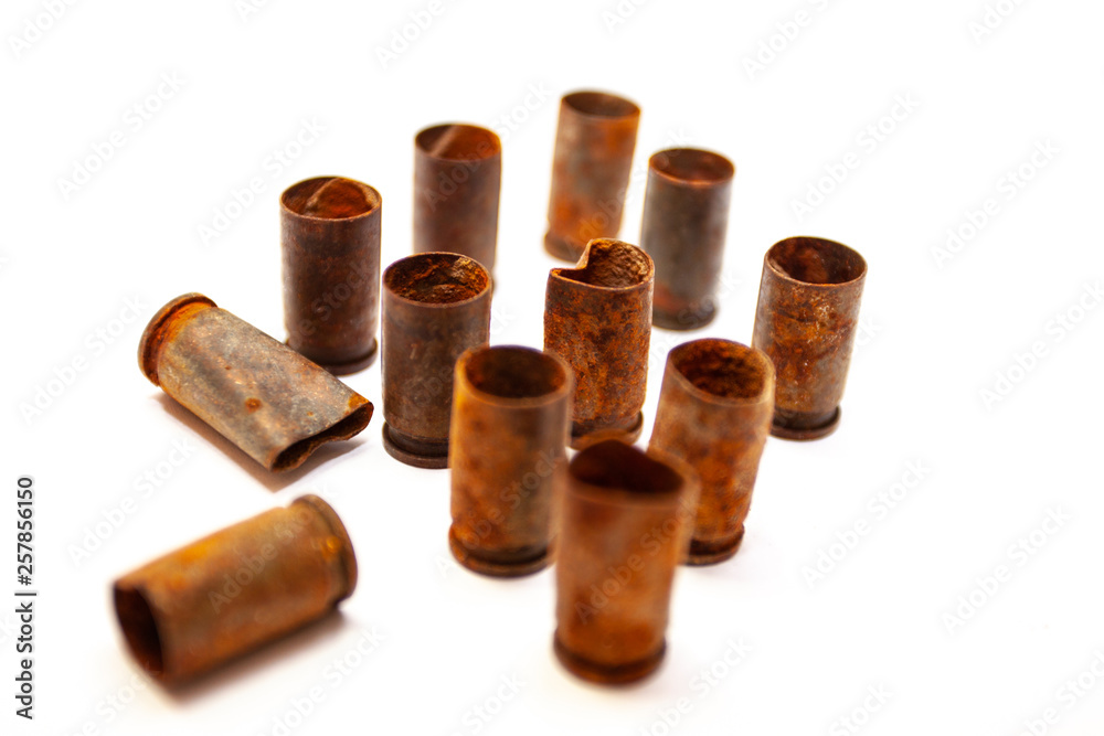 A pile bullet shells on a white background A pile bullet shells on a white background